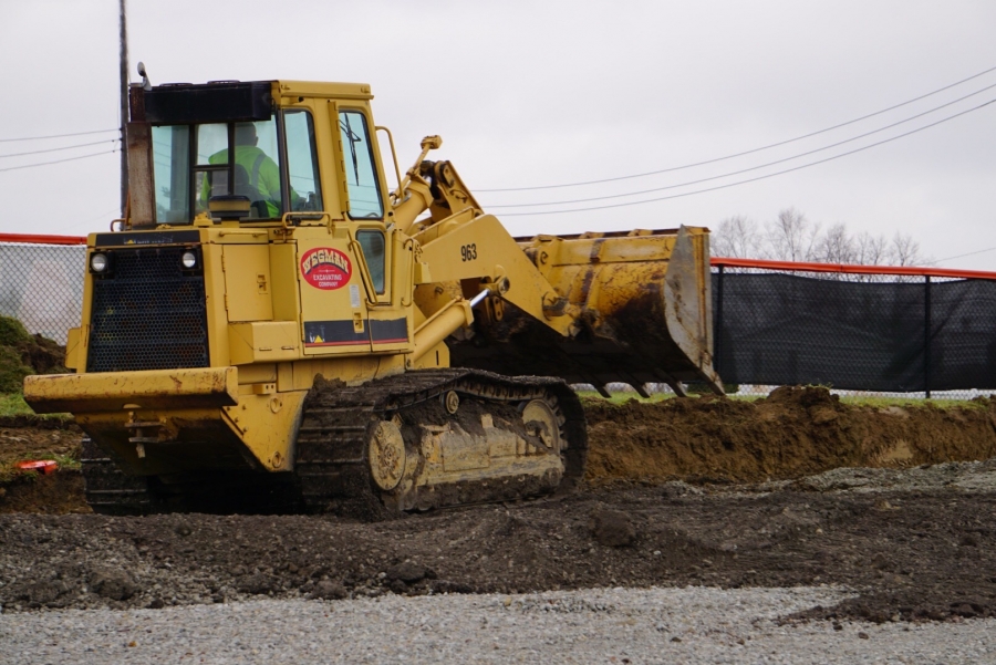 bulldozer on a mound of dirt